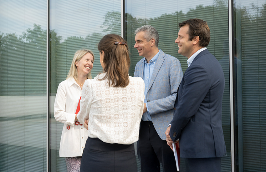 Happy colleagues talking